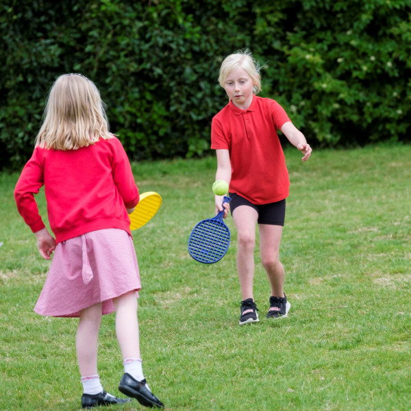 Pupils Practising Tennis